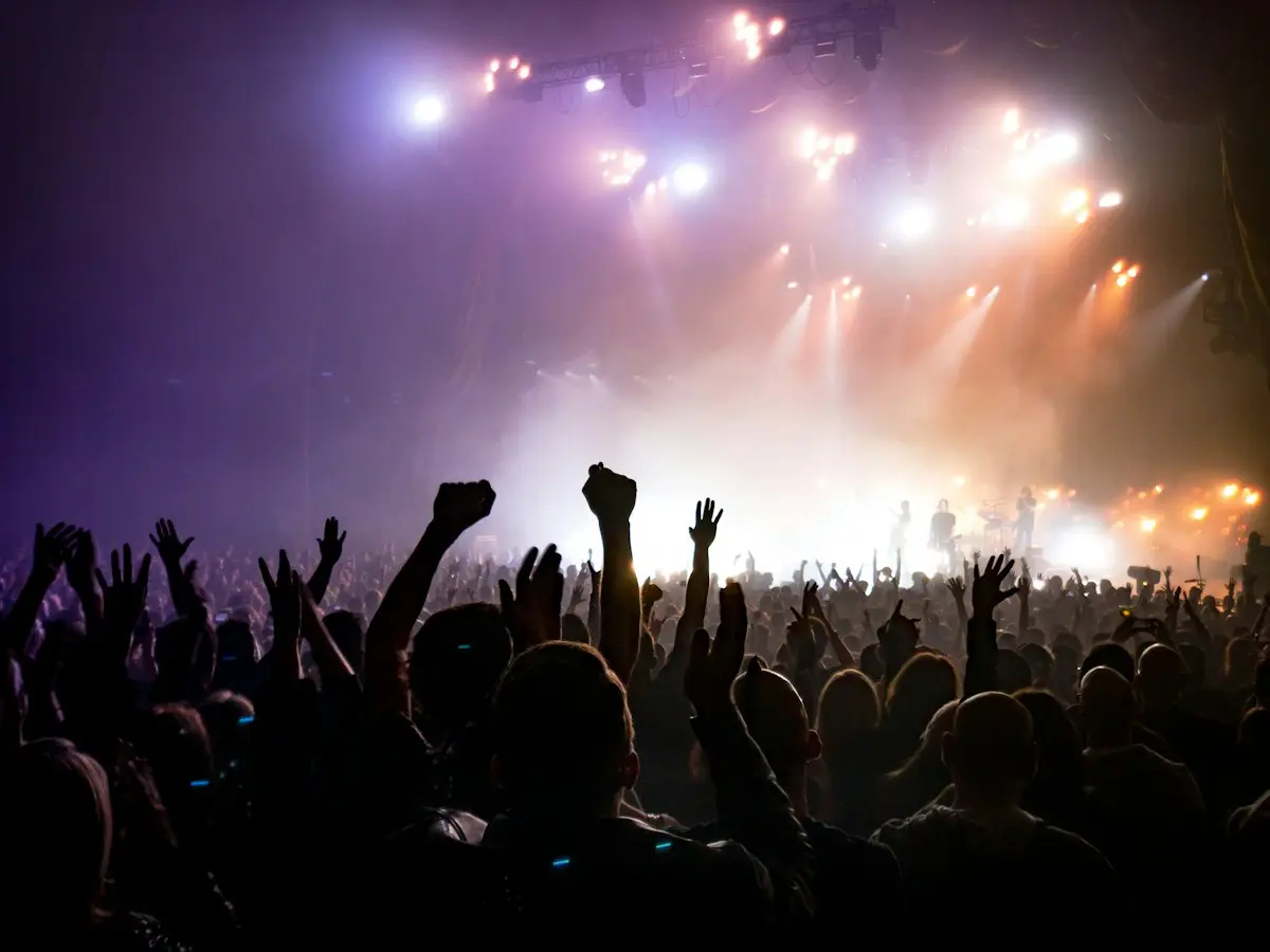 Audience in front of a lit stage